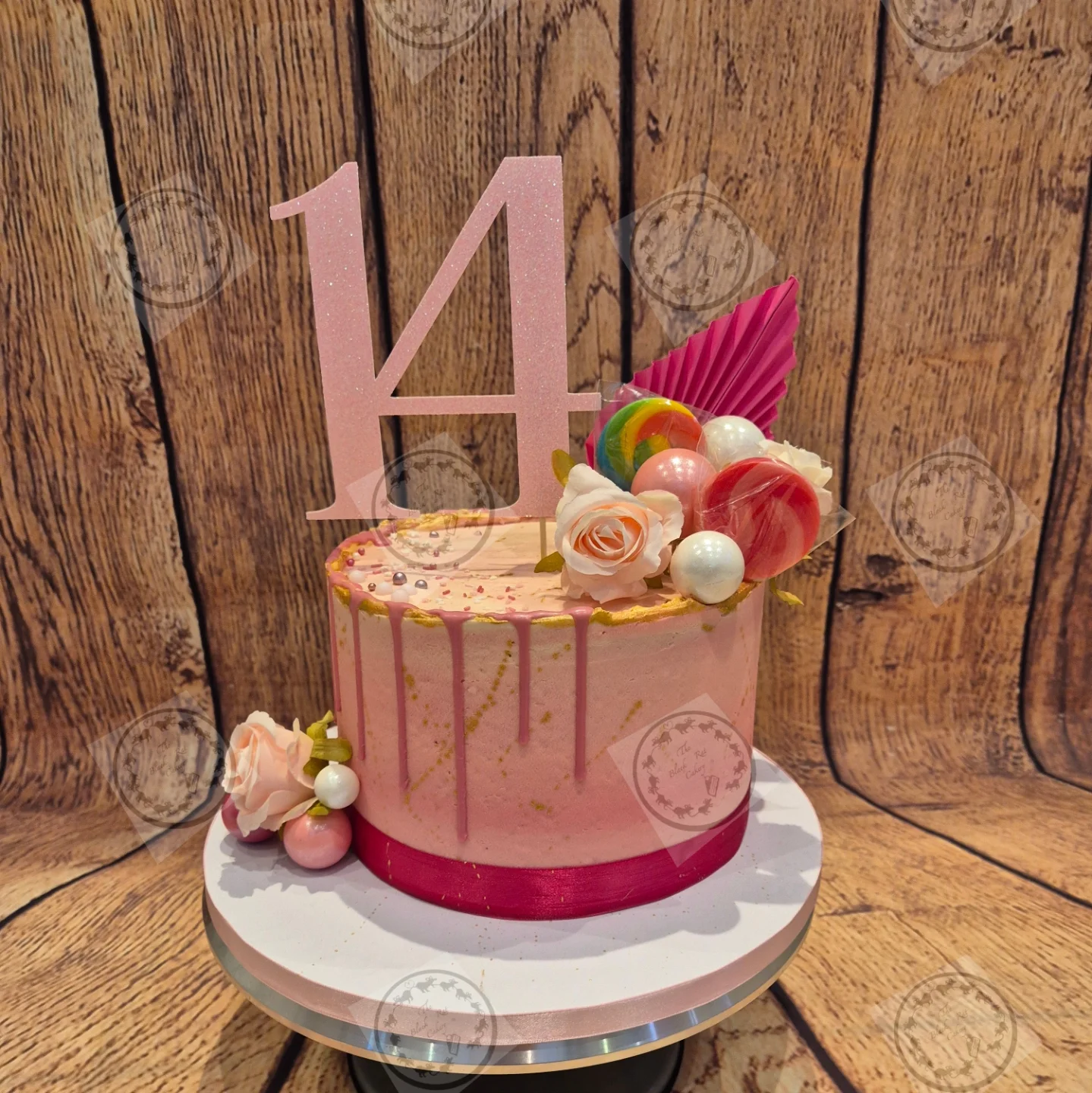 Box of twelve rose-gold and cream celebration cupcakes with pearl and heart toppers
